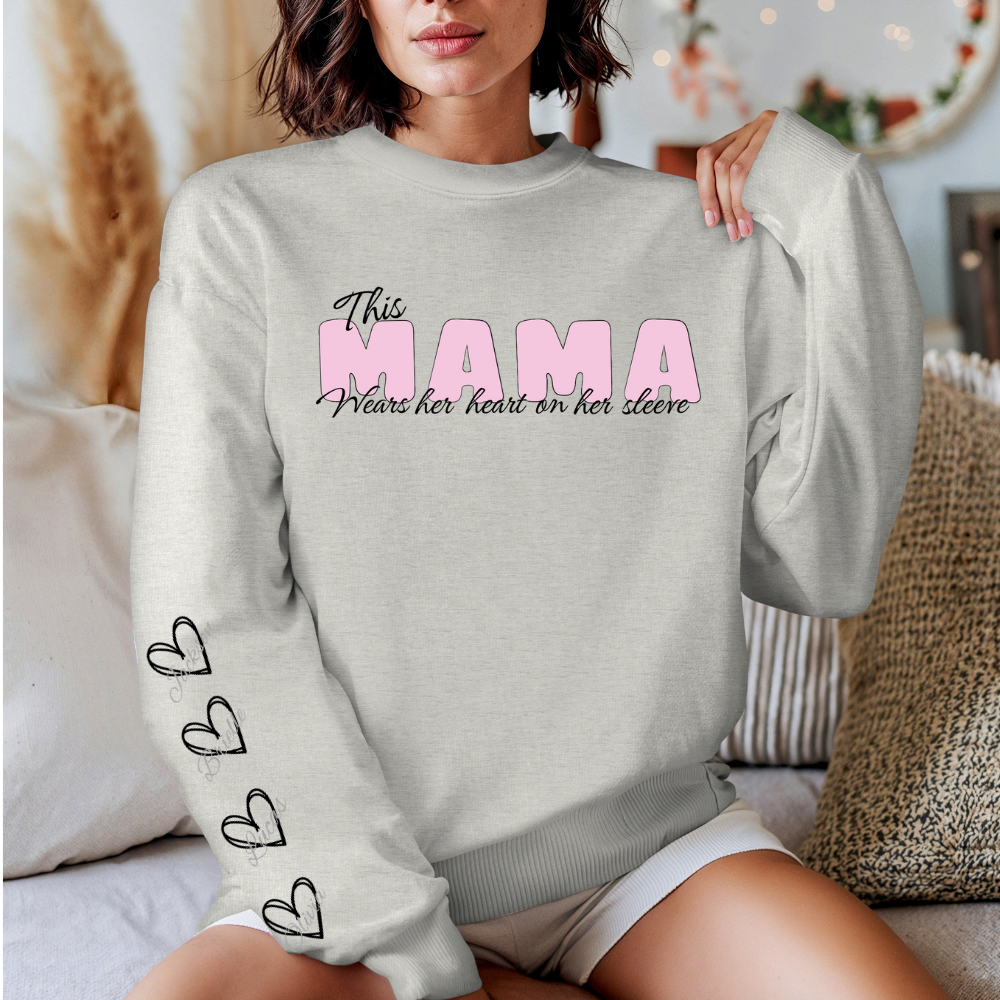 Get trendy with This Mama Wears her Heart on her Sleeve Unisex Crewneck Sweatshirt -  available at Good Gift Company. Grab yours for $34.72 today!